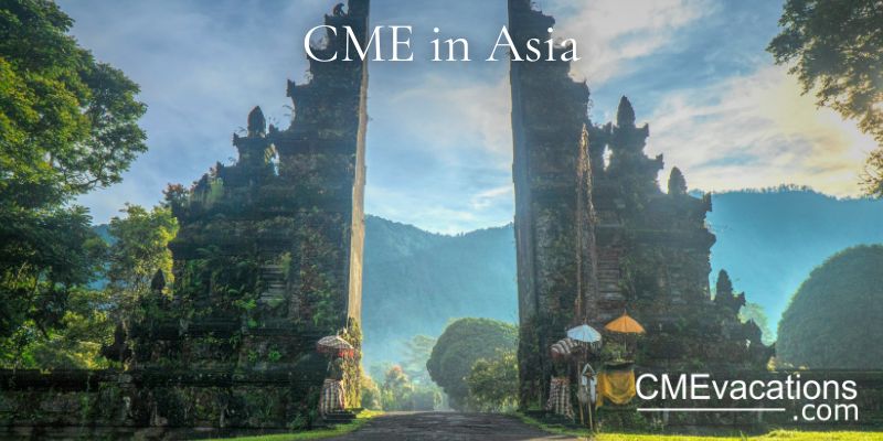 Temple gate with intricate carvings on a mountainous landscape