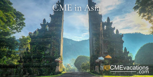 Temple gate with intricate carvings on a mountainous landscape