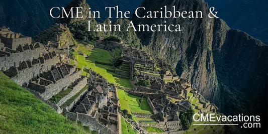 Machu Picchu with ancient Incan ruins and surrounding mountains under a blue sky.